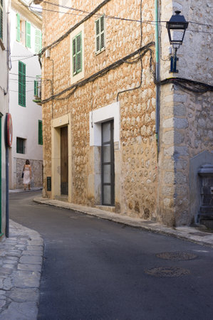Narrow Street with Old Stone Buildings and Shutters
