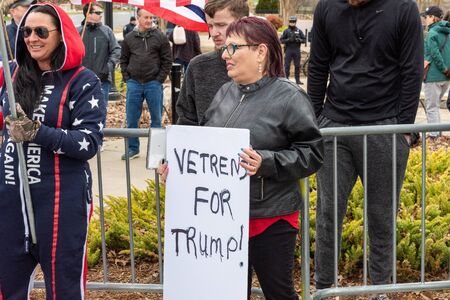 CHARLOTTE, NORTH CAROLINA/USA - February 7, 2020: Woman holds a sign of support for President Donald Trump during his visit to Charlotte, North Carolina on February 7, 2020のeditorial素材