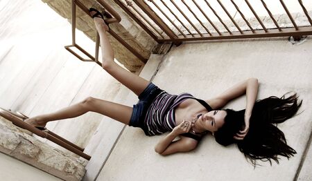 Beautiful model laying down with posing legsの写真素材