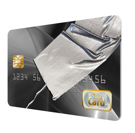 This illustrates credit history that needs repair. A broken credit card is held together with duct tape.の写真素材