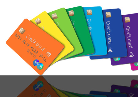 Here are generic, mock credit cards that are lined up in a spectrum of color. These brightly colored card go through the spectrum like a rainbow of color.の写真素材