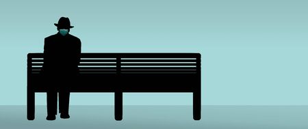 A man wearing surgical masks practices social distancing as he sits on benchs in a public place during the Covid-19 pandemic.の写真素材