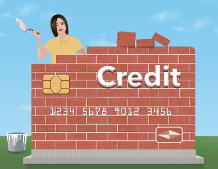 A young woman holds a trowel and mortar as she rebuilds a brick credit card outdoors. The theme is rebuilding or repairing your credit rating.の写真素材