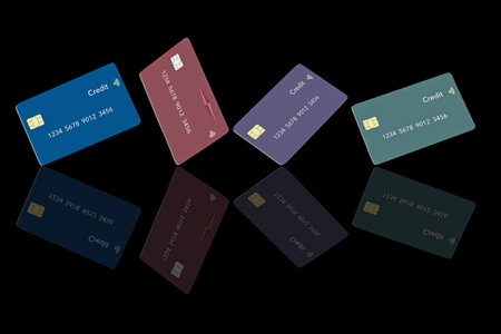 Here are  realistic mock credit card or debit cards that are isolated on the black background. This is a 3-d illustration about bank cards, finances and business.の写真素材