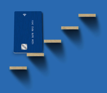 A generic dblue credit or debit card is seen on a small shelf that provides text area or copy space in a 3-d illustration.の写真素材