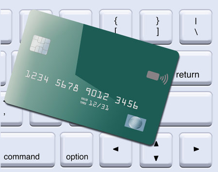 A generic mock credit card or debit card is seen  atop a computer keyboard in a 3-d illustration.の写真素材
