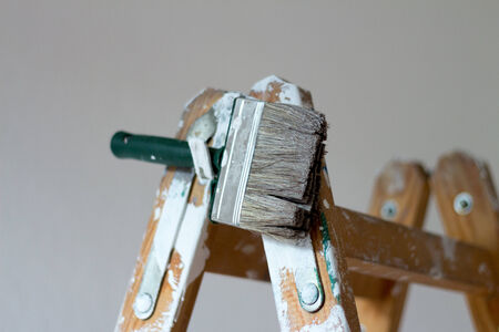 Painters brush on a ladderの写真素材