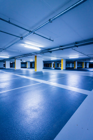 Empty blue parking garage with yellow columnsの写真素材