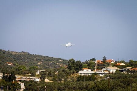 Airplane at take-off at Skiathos Airportの写真素材