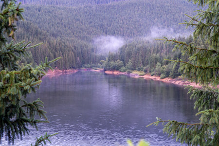 Lake in the mountains. Fog over the lake. Landscape.の写真素材