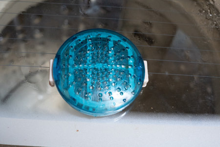 Green closed water filter in a LG washing machineの写真素材