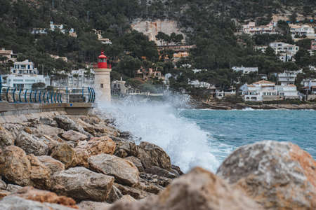 Puerto de Andratx, Spain - April 16, 2019: wind at the sea with lighthouseのeditorial素材