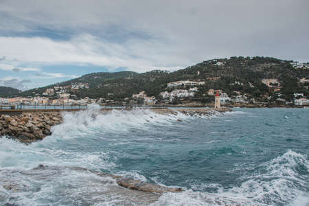 Puerto de Andratx, Spain - April 16, 2019: wind at the sea with lighthouseのeditorial素材