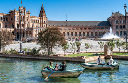 Seville, Spain - November 15, 2019: Sunny day in the Spain Square with boating peopleのeditorial素材