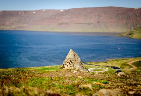 A rock with a lot of nature aroundの写真素材