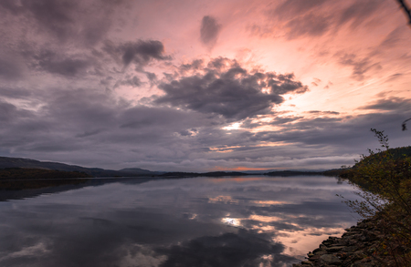 Reflection on a lake in Scotlandの写真素材