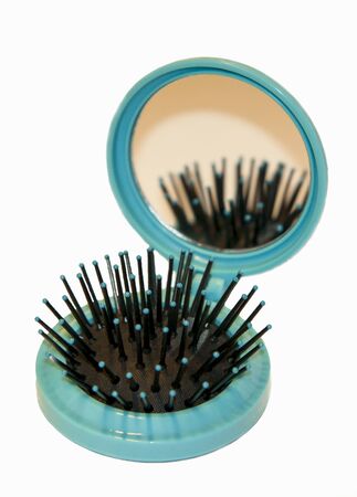 a comb with a mirror on white backgroundの写真素材