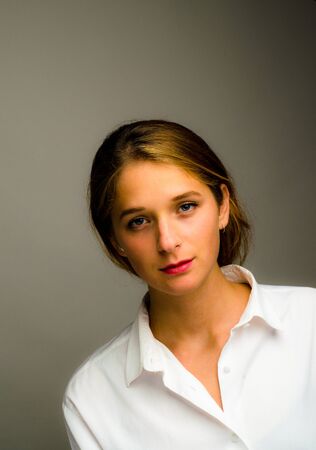 Blonde model posing for photo shoot in a studioの写真素材