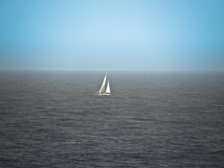 Sailing boat in the blue of the Atlantic Ocean Seaの写真素材