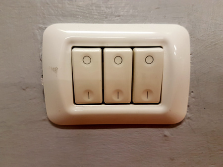 White three-button electrical switch plates