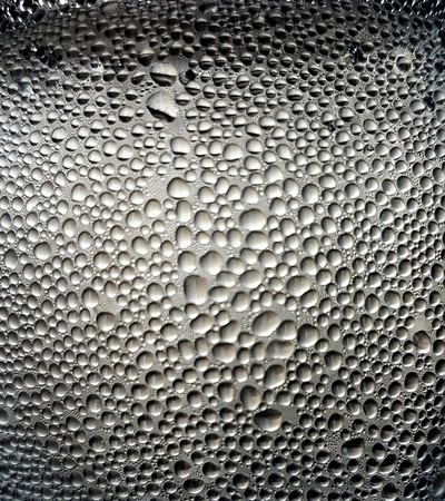 Texture of water drops on a glass surfaceの写真素材