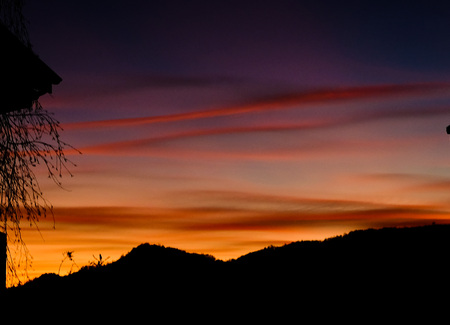 bright and colorful sunset of liguria that hangs on the seaの写真素材