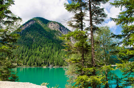 lake braies in the heart of val pusteria in trentino alto adige, a few kilometers from the border with austriaの写真素材
