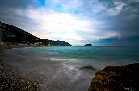 coastal landscapes of the Ligurian beach during the winter seasonの写真素材