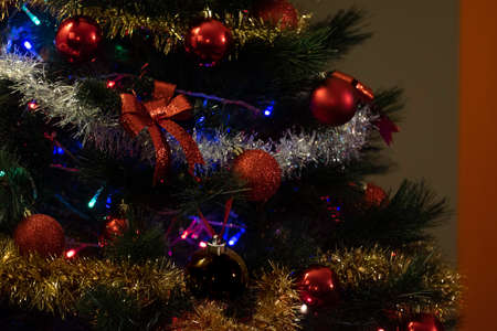 christmas balls decorating the christmas tree during the holiday season
