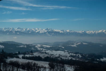 the snow-covered monviso mountain range in the Piedmontese Langhe near Alba, in January 2022