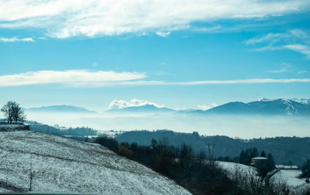 the snow-covered monviso mountain range in the Piedmontese Langhe near Alba, in January 2022の写真素材