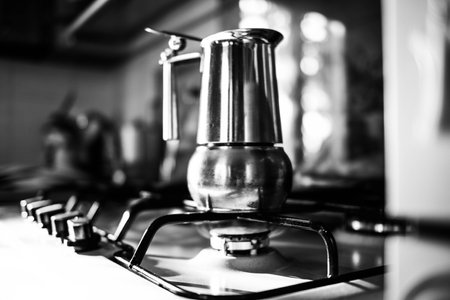 a percolator on the blue gas fire, making hot black coffeeの写真素材