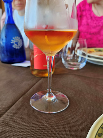 glass of wine on a table in a restaurant, close-upの写真素材