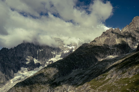 Mountain landscape with clouds and blue sky. Caucasus, Dombaj.の写真素材