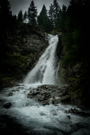 spectacular mountain landscapes of waterfalls and streams in Livigno in Valtellina on the border...