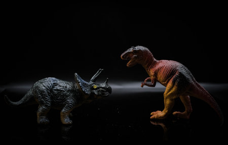 Dinosaur toys on a black background. Dinosaur toy on black background