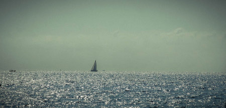 Sailboat in the sea. Vintage style toned picture.の写真素材