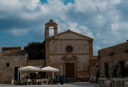 the square of Marzamemi with the ancient Church of the Madonna del Carmelo, commonly called "Church of the Tonnara", is adjacent to the architectural complex of the Tonnaraの写真素材