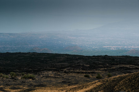 Etna, in Sicilian Muncibbe, is a complex stratovolcano of Sicily that originated in the Quaternary, and is the highest active volcano of the Eurasian plate.の写真素材