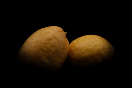 Lemons on a black background. Close-up image.の写真素材