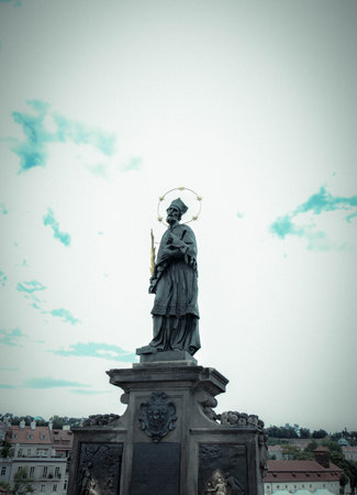 the statue of John of Nepomuk on St. Charles Bridge, or Nepomuk, was a Czech priest, canon in the Prague Cathedral and preacher at the court of King Wenceslasの写真素材