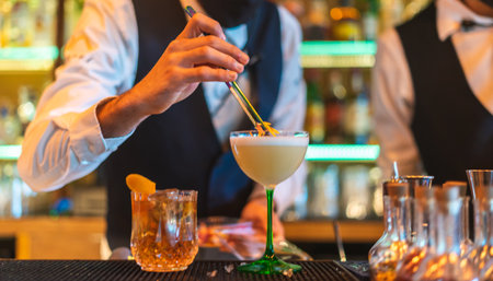 Barman making cocktail at night clubの写真素材