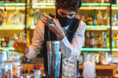 Barman making cocktail at night clubの写真素材