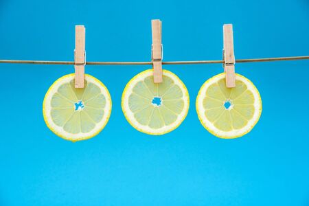 Lemon slices on light blue background