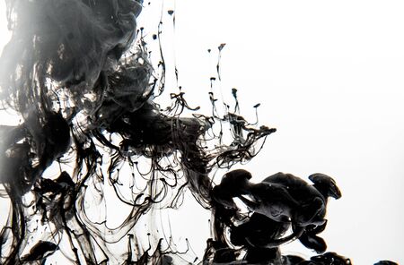 Watercolor pigment on transparent waterの写真素材