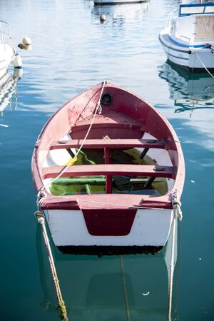 Old fisherman's boat anchored in the harborの写真素材