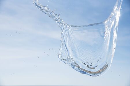 Water in the air with the sea and sky background