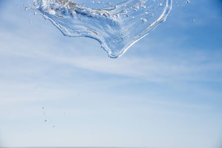 Water in the air with the sea and sky backgroundの写真素材