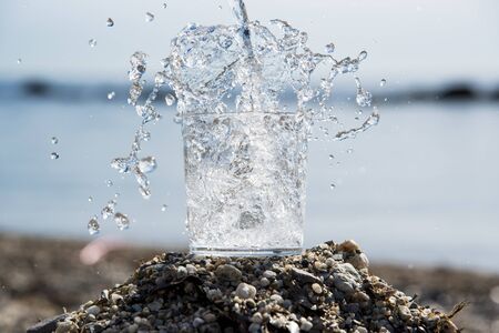 Water in the air with the sea and sky backgroundの写真素材