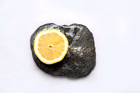 Fresh and juicy lemons cut on white background